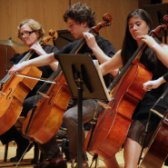 Photo of students playing in an orchestra